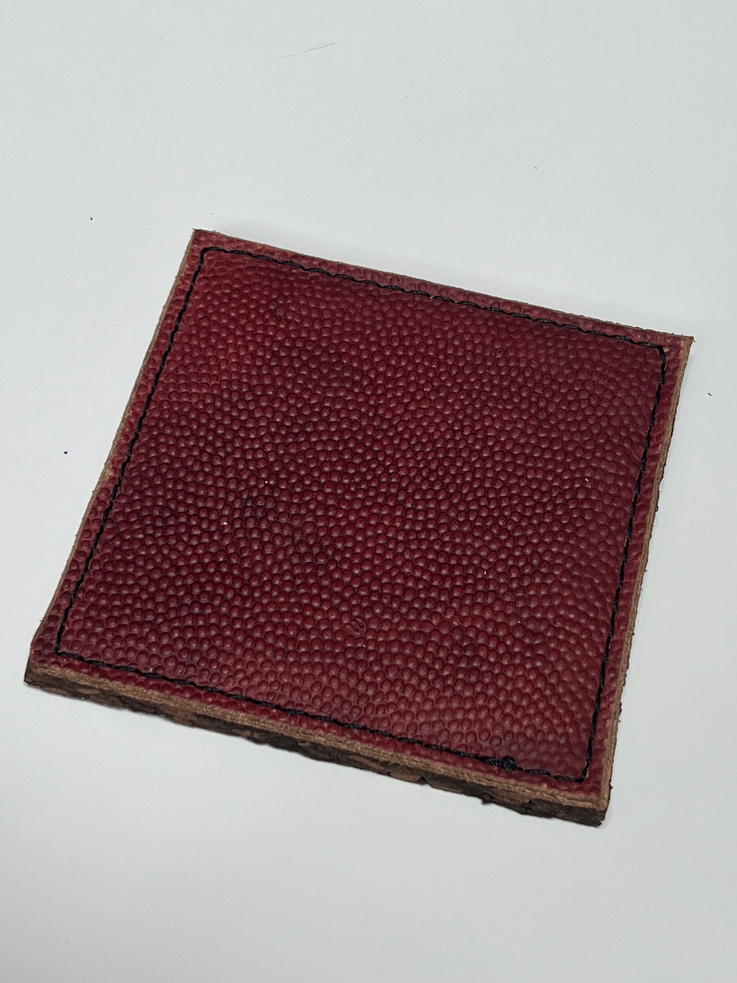 Top cover of the coaster with football texture leather